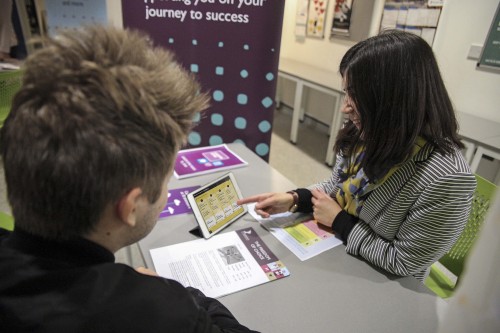 Member of the Careers team works with a student